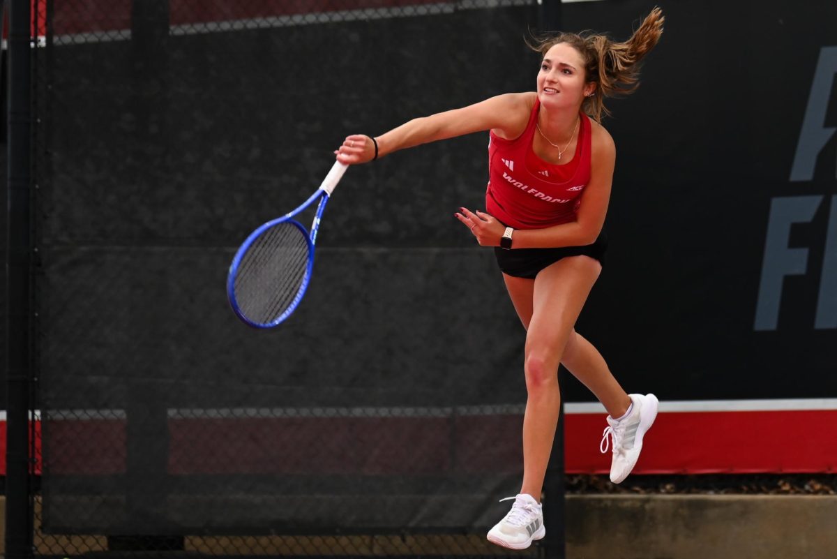 Junior Jasmine Conway slams a serve during the match against UCF in the second round of the NCAA Womens Tennis Championship at J.W. Isenhour Tennis Center on Saturday, May 2, 2026. The Wolfpack defeated the Knights 4-0.