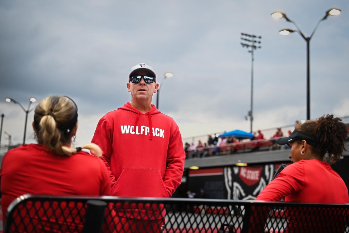 Head coach Simon Earnshaw consults junior Gabriella Broadfoot and freshman Victoria Osuigwe in between games during the match against UCF in the second round of the NCAA Womens Tennis Championship at J.W. Isenhour Tennis Center on Saturday, May 2, 2026. The pair defeated their opponent 6-2. The Wolfpack defeated the Knights 4-0. 