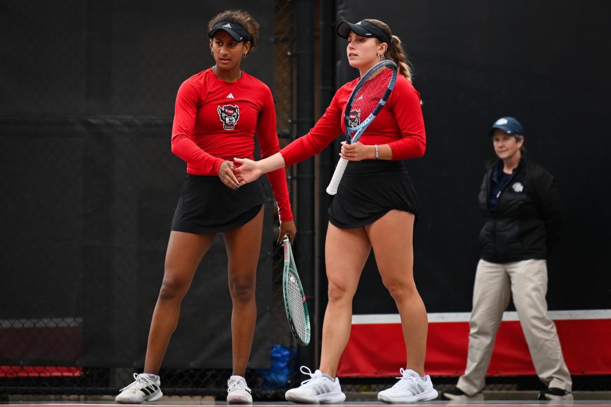 Freshman Victoria Osuigwe and junior Gabriella Broadfoot high-five during the match against UCF in the second round of the NCAA Womens Tennis Championship at J.W. Isenhour Tennis Center on Saturday, May 2, 2026. The pair defeated their opponent in the doubles match by a score of 6-2. The Wolfpack defeated the Knights 4-0. 