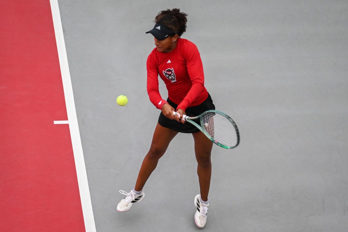 Freshman Victoria Osuigwe concentrates on a backhand during the match against UCF in the second round of the NCAA Womens Tennis Championship at J.W. Isenhour Tennis Center on Saturday, May 2, 2026. Osuigwe defeated her singles opponent by a score of 6-1,6-0 in straight sets. The Wolfpack defeated the Knights 4-0.