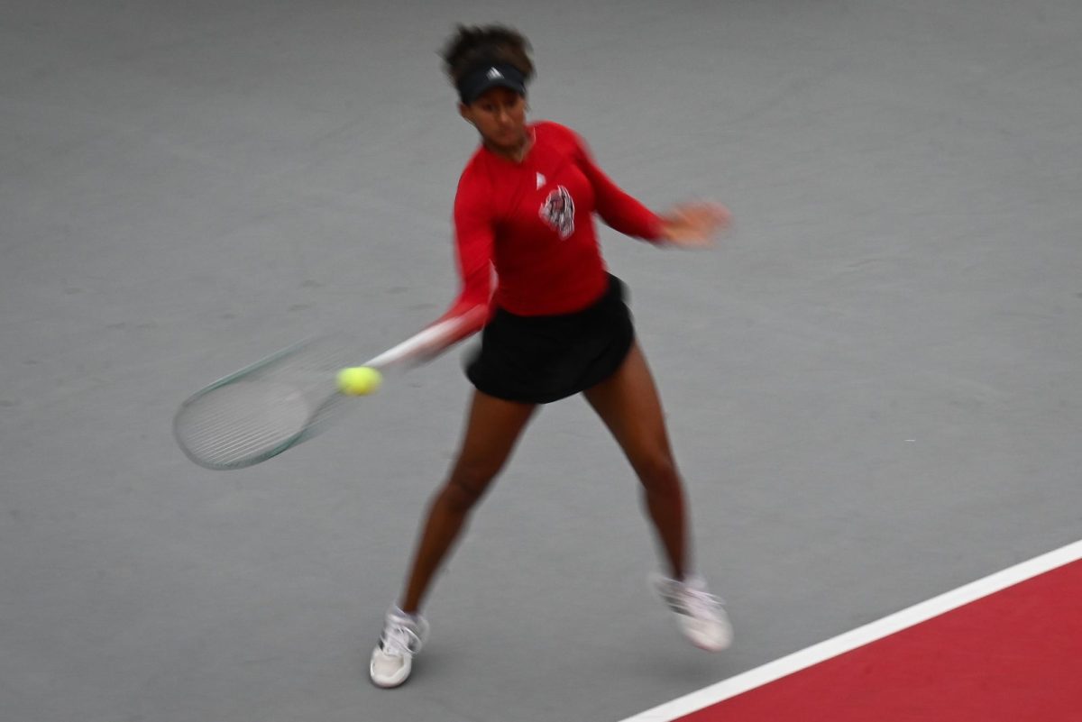 Freshman Victoria Osuigwe hits a forehand during the match against UCF in the second round of the NCAA Womens Tennis Championship at J.W. Isenhour Tennis Center on Saturday, May 2, 2026. Osuigwe defeated her singles opponent by a score of 6-1,6-0 in straight sets. The Wolfpack defeated the Knights 4-0.