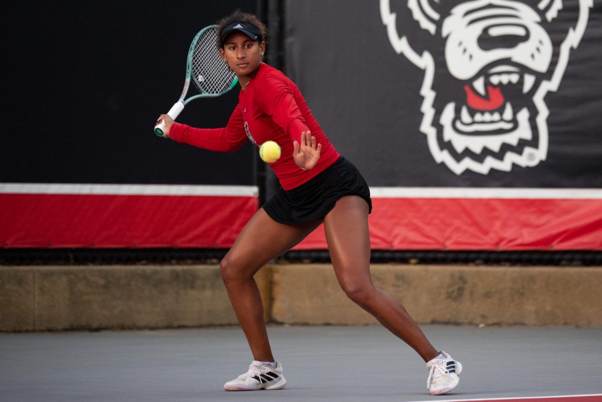 Freshman Victoria Osuigwe leans into her swing during the match against UCF in the second round of the NCAA Womens Tennis Championship at J.W. Isenhour Tennis Center on Saturday, May 2, 2026. Osuigwe defeated her singles opponent by a score of 6-1,6-0 in straight sets. The Wolfpack defeated the Knights 4-0.