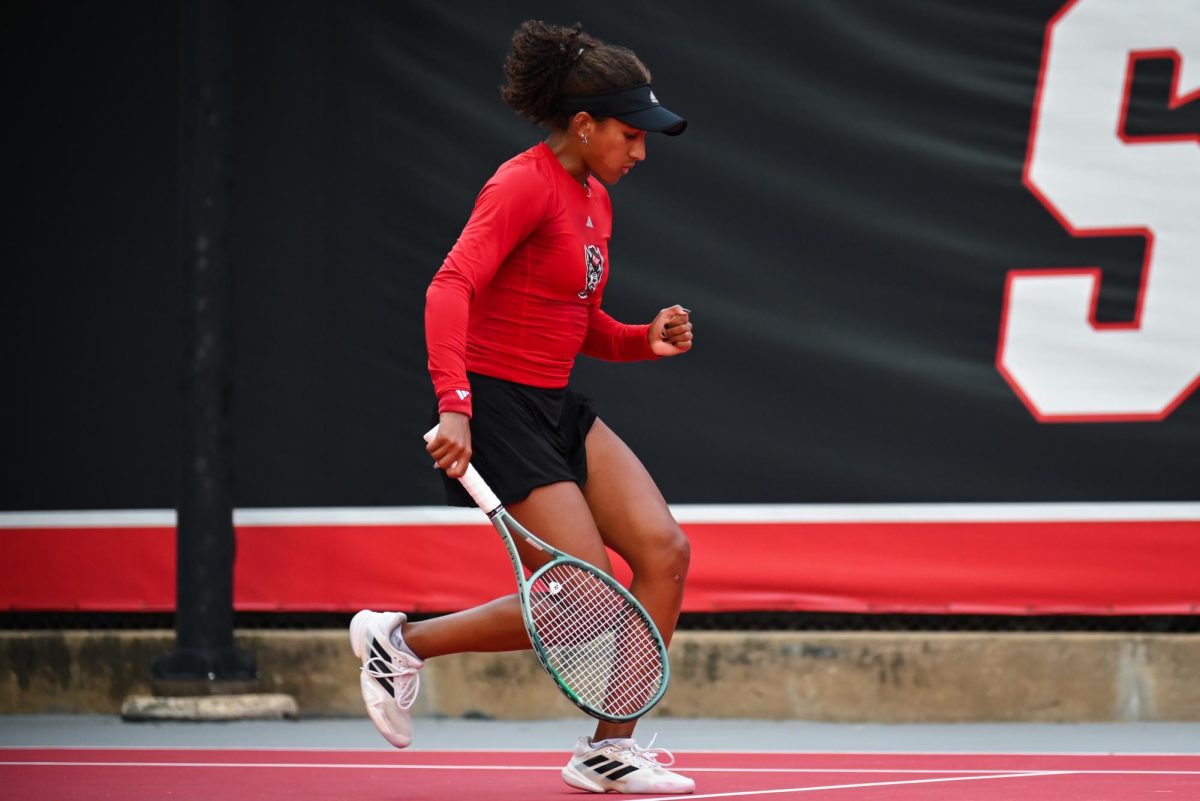 Freshman Victoria Osuigwe pumps her fist during the match against UCF in the second round of the NCAA Womens Tennis Championship at J.W. Isenhour Tennis Center on Saturday, May 2, 2026. Osuigwe defeated her singles opponent by a score of 6-1,6-0 in straight sets. The Wolfpack defeated the Knights 4-0.