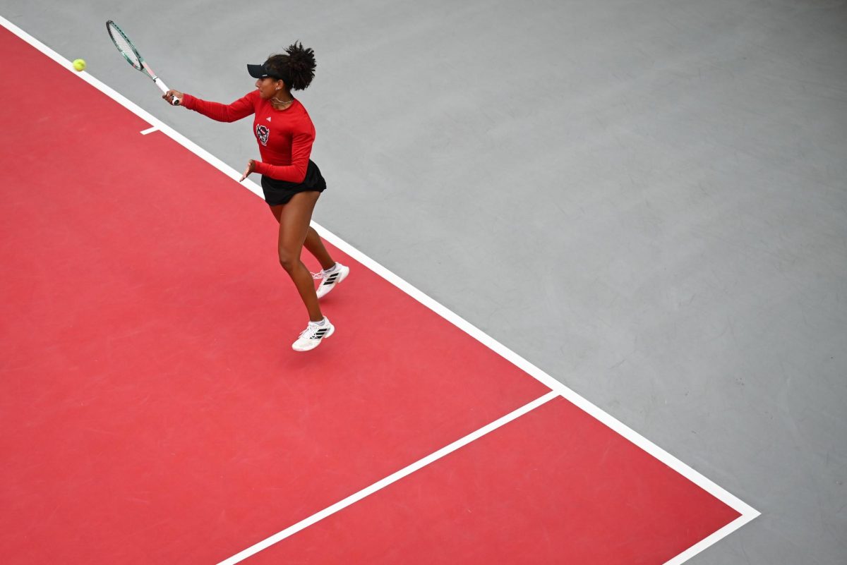 Freshman Victoria Osuigwe smacks a forehand during the match against UCF in the second round of the NCAA Womens Tennis Championship at J.W. Isenhour Tennis Center on Saturday, May 2, 2026. Osuigwe defeated her singles opponent by a score of 6-1,6-0 in straight sets. The Wolfpack defeated the Knights 4-0.