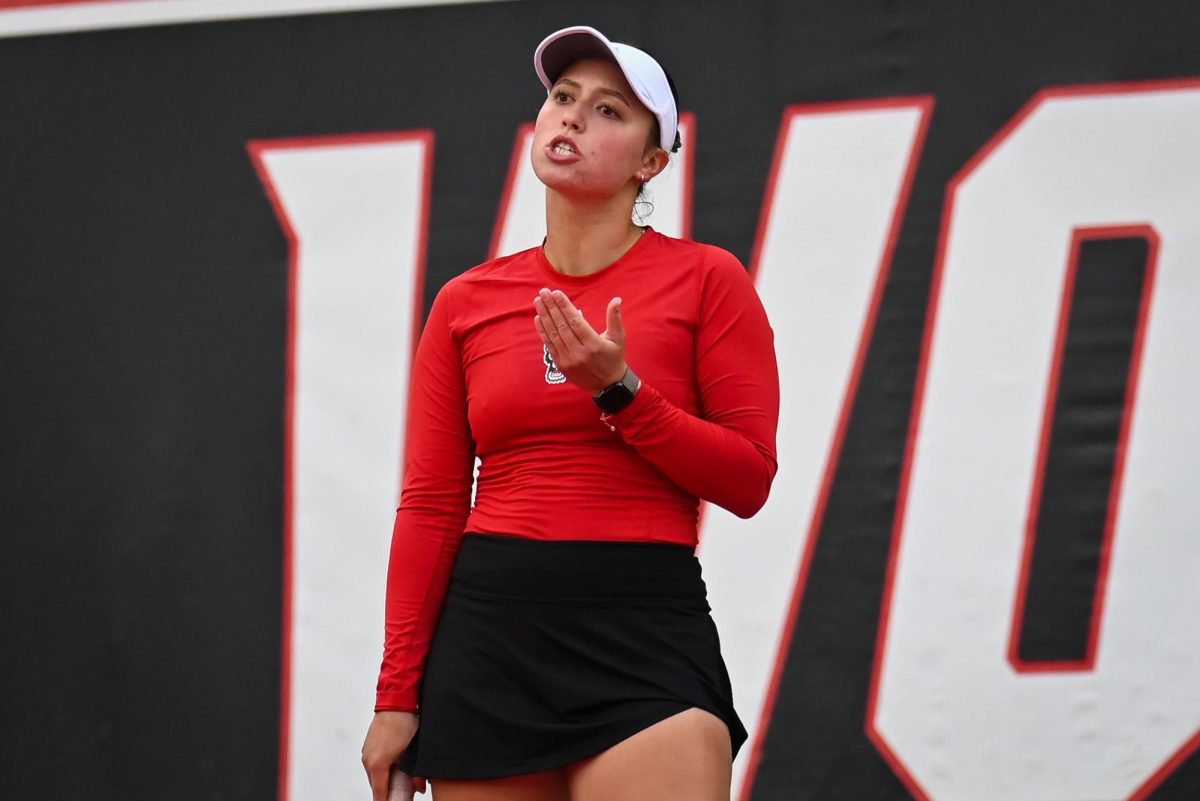 Senior Anna Zyryanova talks to herself in frustration after losing a point during the match against UCF in the second round of the NCAA Womens Tennis Championship at J.W. Isenhour Tennis Center on Saturday, May 2, 2026. The Wolfpack defeated the Knights 4-0.