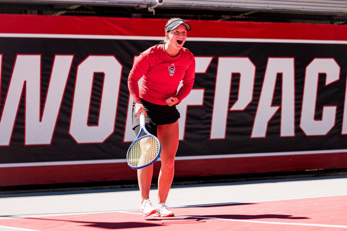 Sophomore Amelie Smejkalova reacts to scoring a point during the match against Syracuse at Dail Outdoor Tennis Stadium on Sunday, March 29, 2026. Smejkalova won her singles match (6-2, 6-2). NC State beat Syracuse 7-0.