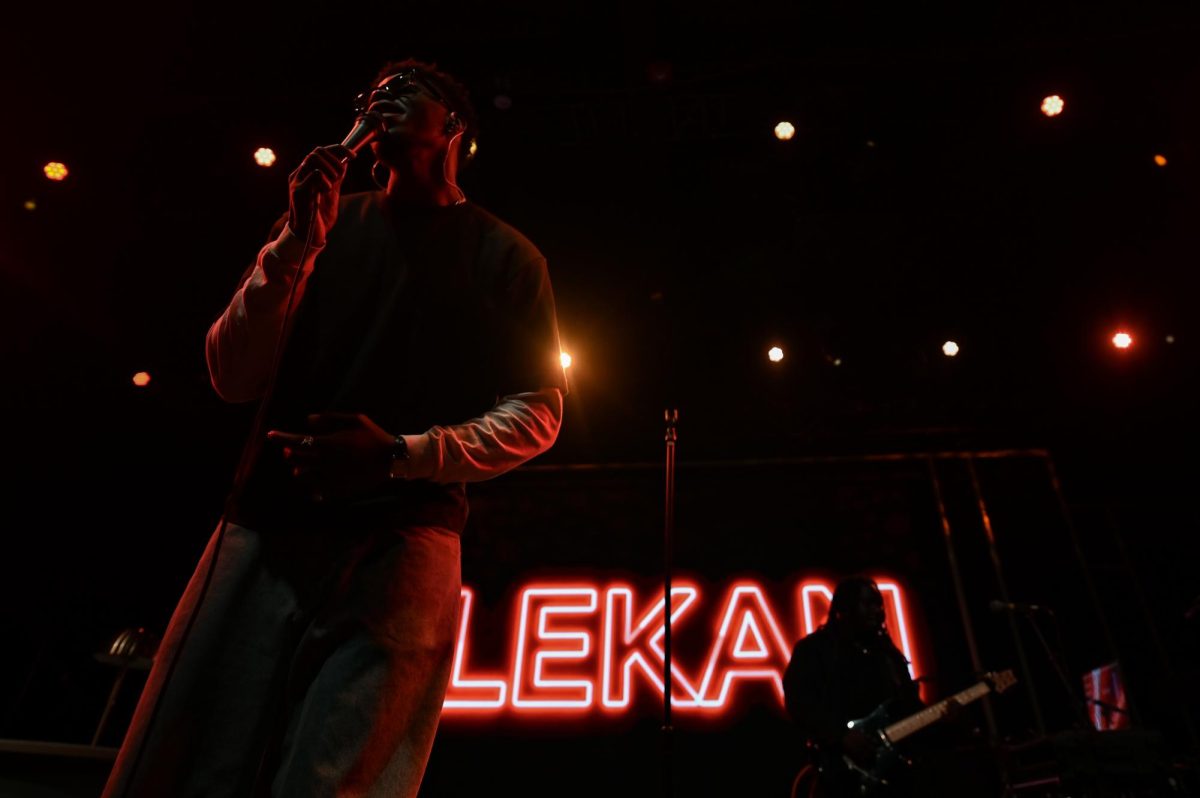 Lekan, a Nigerian-American R&B artist, sings into a microphone as an opening act for Ari Lennox at The Ritz Raleigh on Wednesday, June 3, 2026.