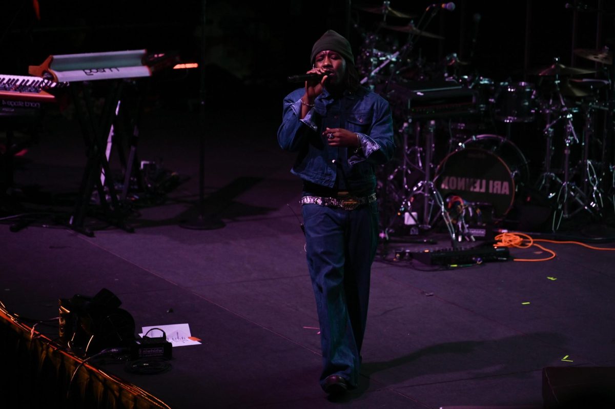 PHABO, an American R&B artist, sings into a microphone as an opening act for Ari Lennox at The Ritz Raleigh on Wednesday, June 3, 2026.