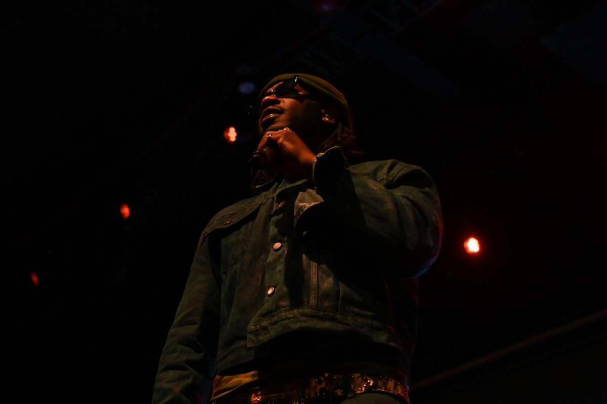 PHABO, an American R&B artist, sings into a microphone as an opening act for Ari Lennox at The Ritz Raleigh on Wednesday, June 3, 2026.