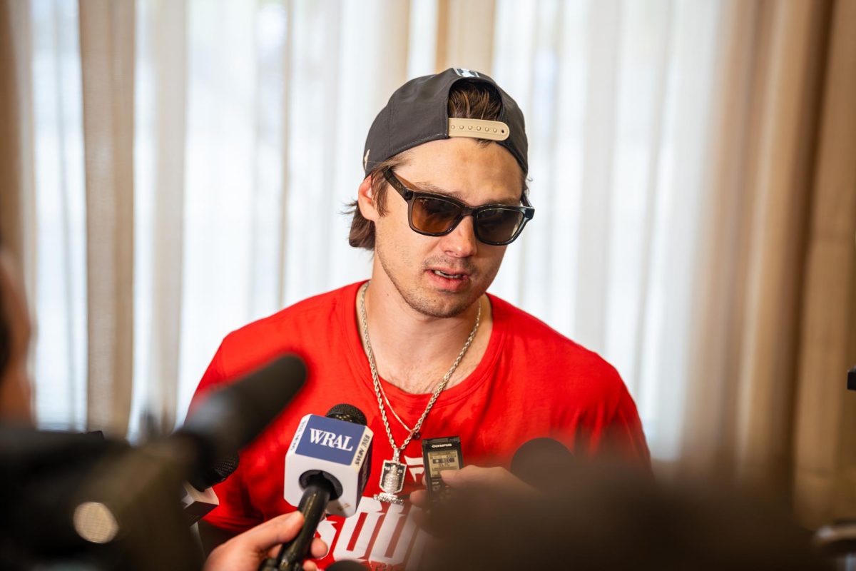 Hurricanes center Sebastian Aho speaks with the media during the Canes Stanley Cup parade at Downtown Raleigh on Saturday, June 20, 2026. The massive parade celebrated the team's dominant 16-3 postseason run, which concluded with a decisive 3-0 shutout victory over the Vegas Golden Knights in Game 6 of the finals.