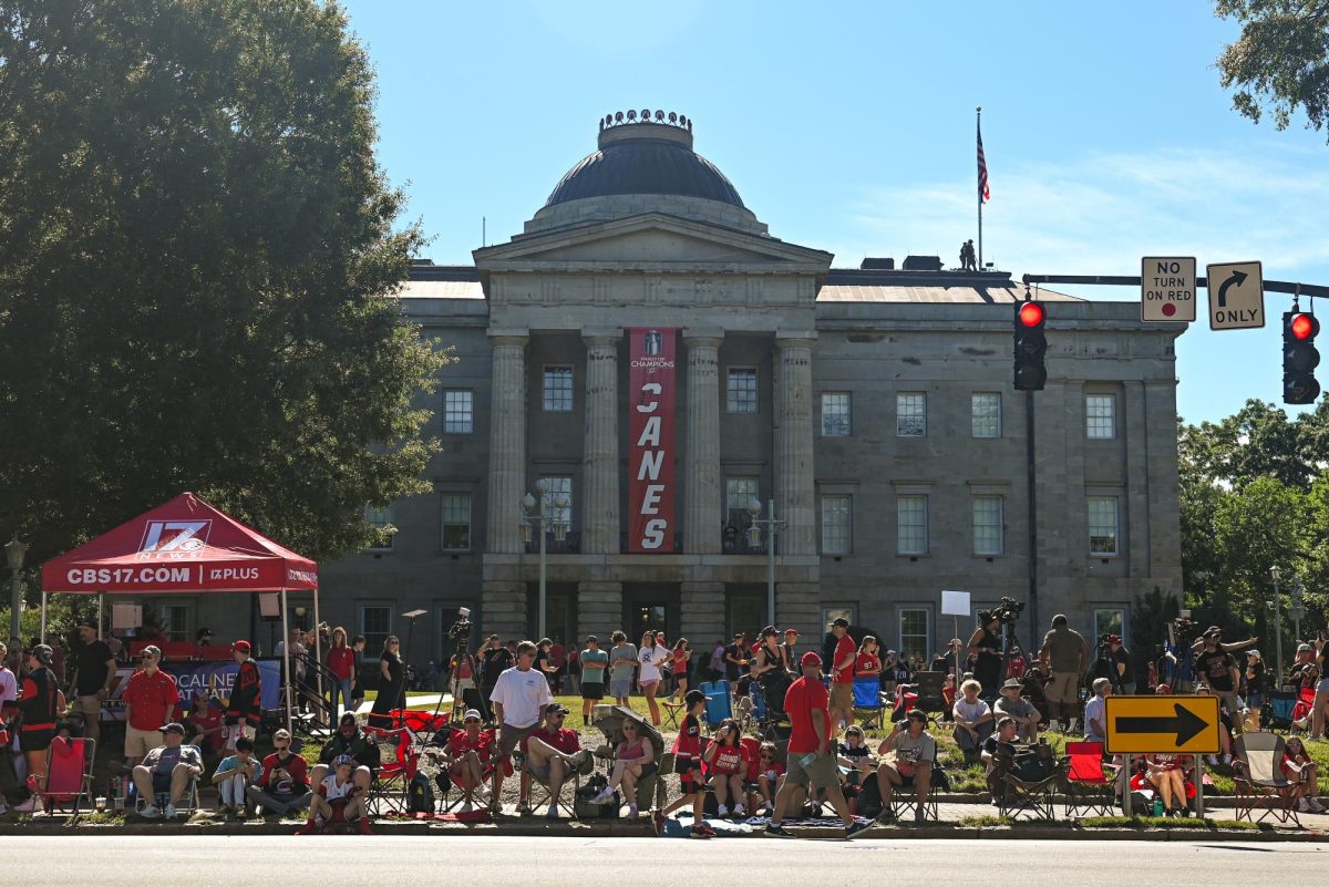Hurricanes fans crowd around the North Carolina State Capitol Building in Downtown Raleigh on June 20, 2026 during the Carolina Hurricanes Championship Parade. The parade celebrated the Hurricanes victory in the 2026 Stanley Cup after a 20 year drought.