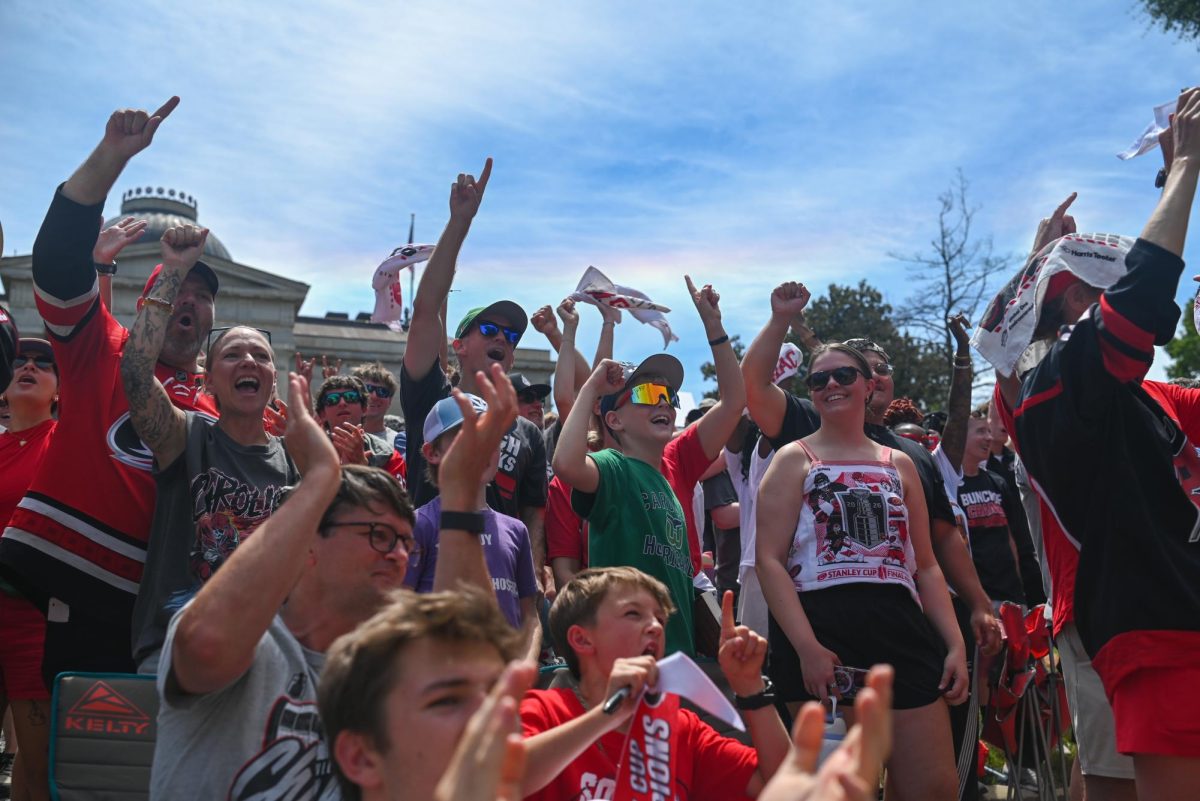Hurricanes fans crowd around the North Carolina State Capitol Building in Downtown Raleigh on June 20, 2026 during the Carolina Hurricanes Championship Parade. The parade celebrated the Hurricanes victory in the 2026 Stanley Cup after a 20 year drought.