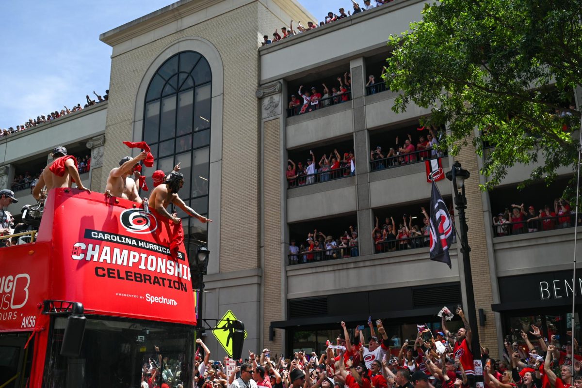 Hurricanes players cheer at the streets of Downtown Raleigh during the Carolina Hurricanes Championship Parade on June 20,2026. The parade had an attendance of 100000+ hockey fans from all parts of NC and the United States.