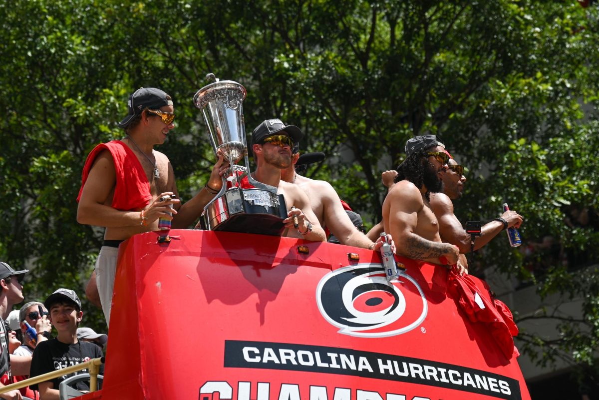 Hurricanes players hold The Prince of Wales Trophy during the Carolina Hurricanes Championship Parade in Downtown Raleigh on June 20, 2026. The trophy is given to the NHL’s Eastern Conference Champions.