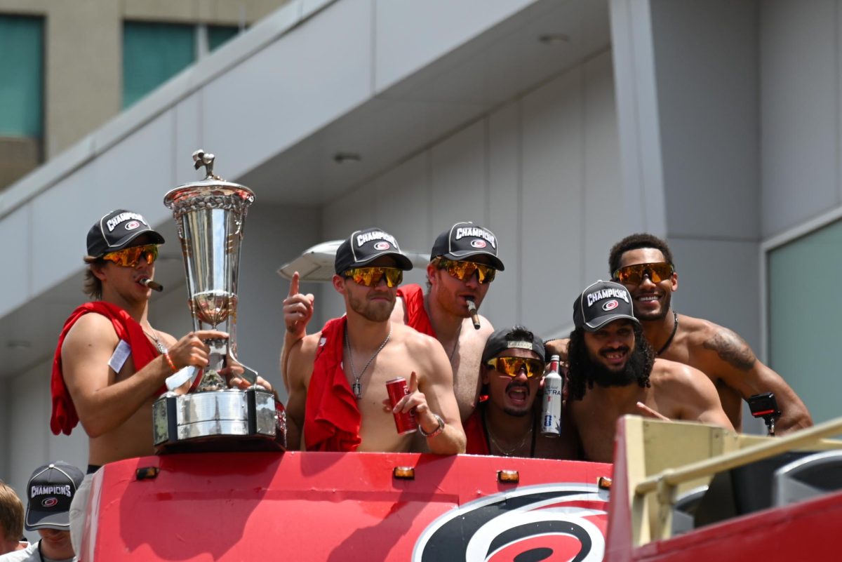 Hurricanes players hold The Prince of Wales Trophy during the Carolina Hurricanes Championship Parade in Downtown Raleigh on June 20, 2026. The trophy is given to the NHL’s Eastern Conference Champions.