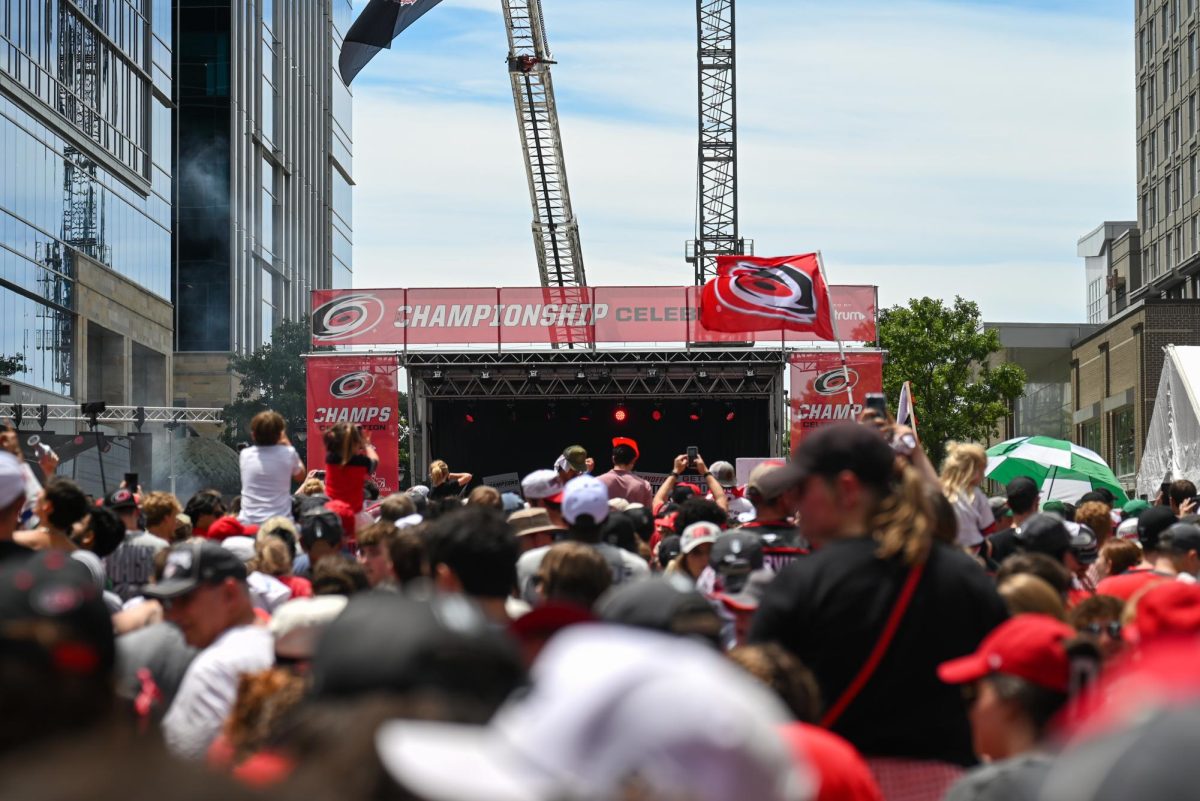 Hurricanes fans gather around the stage at the end of the Carolina Hurricanes Championship Parade in Downtown Raleigh on June 20, 2026. The parade had an attendance of 100000+ hockey fans from all parts of NC and the United States.