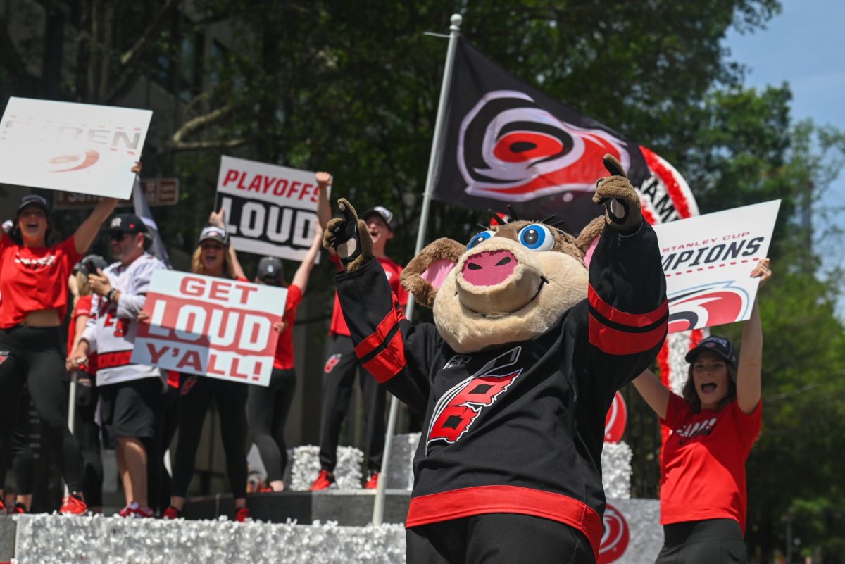 Carolina Hurricanes Mascot, Stormy, cheers at the fans during the Carolina Hurricanes Championship Parade in Downtown Raleigh on June 20, 2026. The parade had an attendance of 100000+ hockey fans from all parts of NC and the United States.