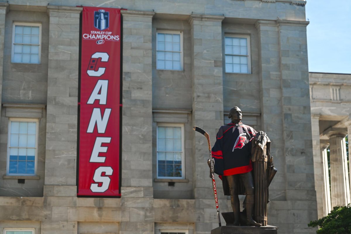 The George Washington Statue in front of the NC Capitol Building wears a Hurricanes Jersey during the Carolina Hurricanes Championship Parade in Downtown Raleigh on June 20, 2026. The parade had an attendance of 100000+ hockey fans from all parts of NC and the United States.