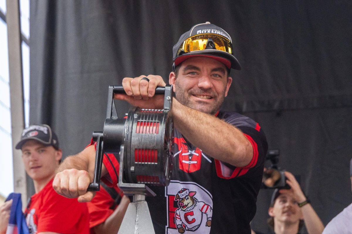 Left wing Jordan Martinook sounds the traditional storm siren during the Championship Celebration in downtown Raleigh on Saturday, June 20, 2026. The siren signaled the start of the formal rally at the end of the parade route.