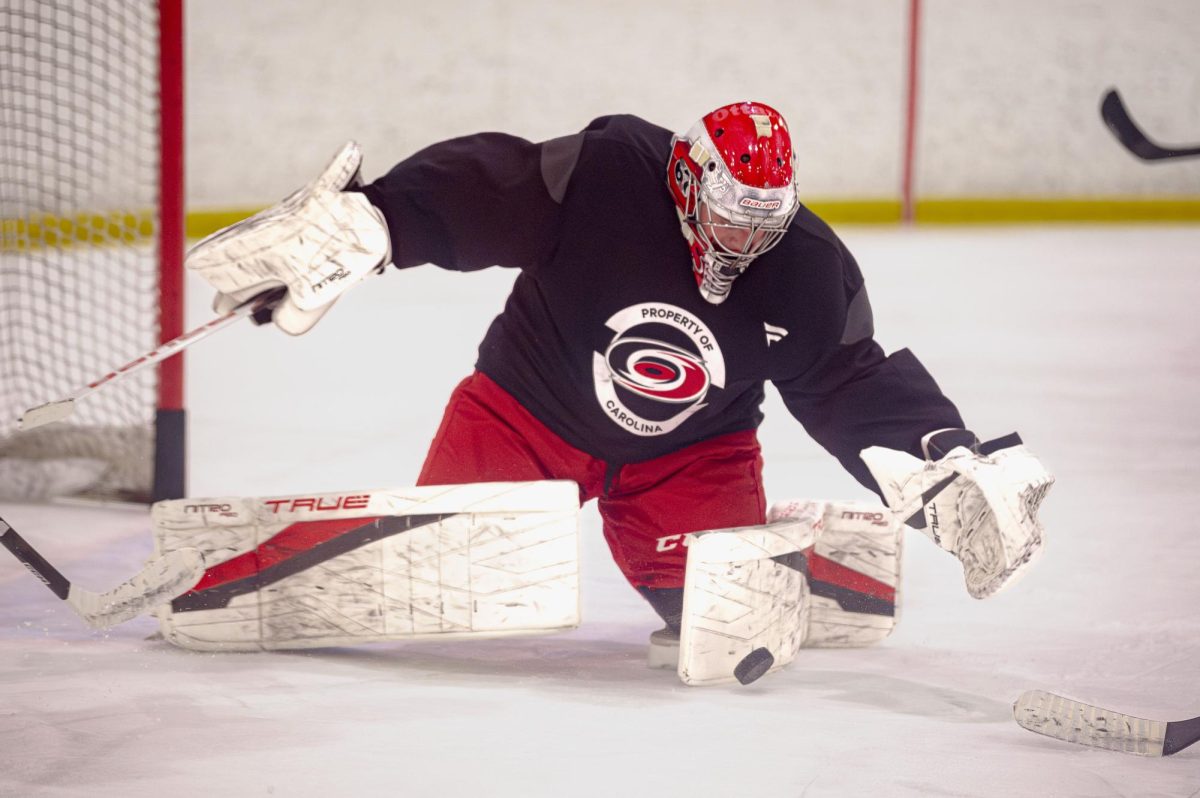 Goaltender Ryder Fetterolf (33) scoops up a loose puck during the Hurricanes 2026 Prospects Development Camp on Monday, June 29, 2026. Players competed in off-ice training and educational sessions, as well as on-ice sessions at Invisalign Arena.