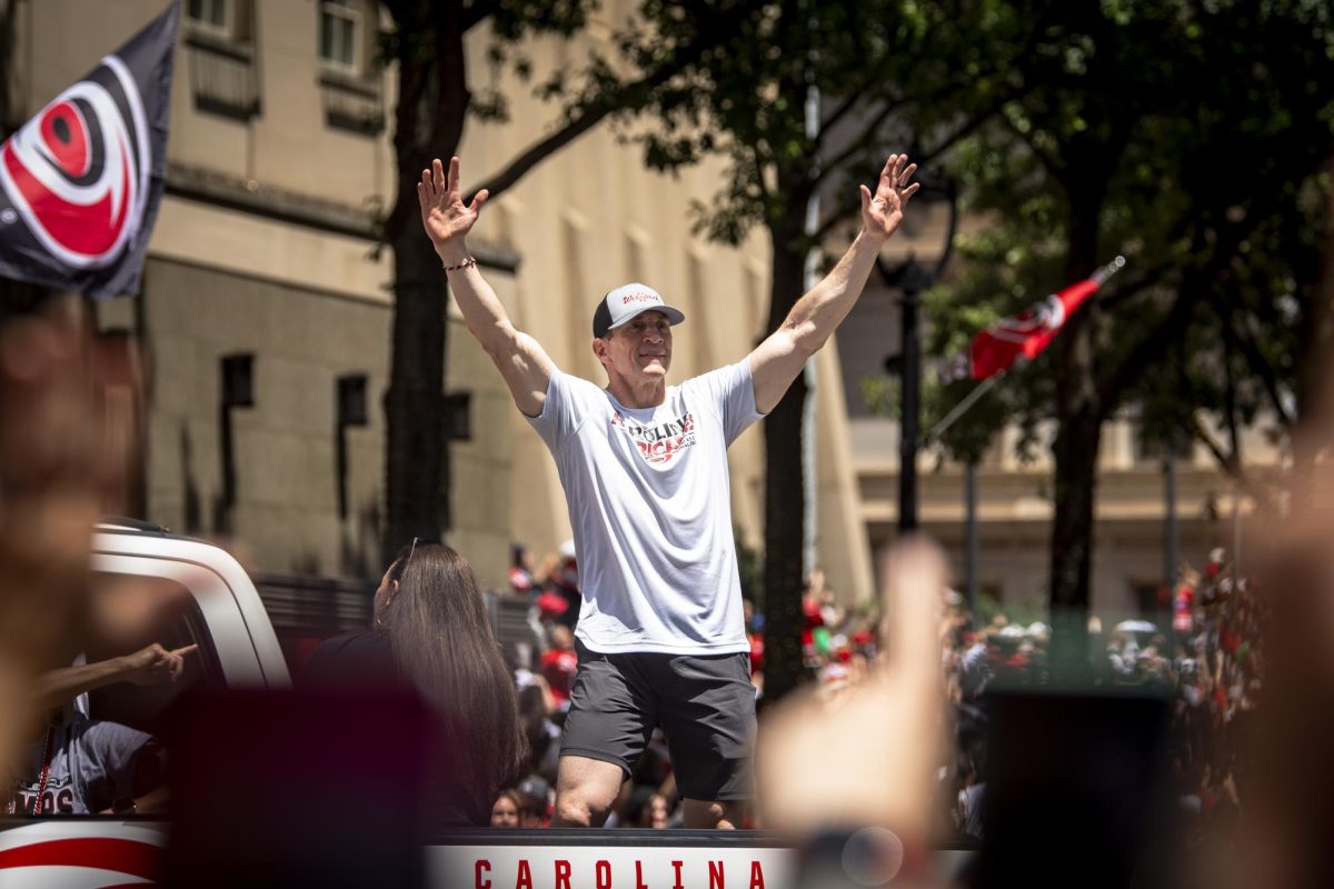 Hurricanes head coach Rod Brind'Amour motions to the crowd during the Carolina Hurricanes Championship Celebration in downtown Raleigh on Saturday, June 20, 2026.