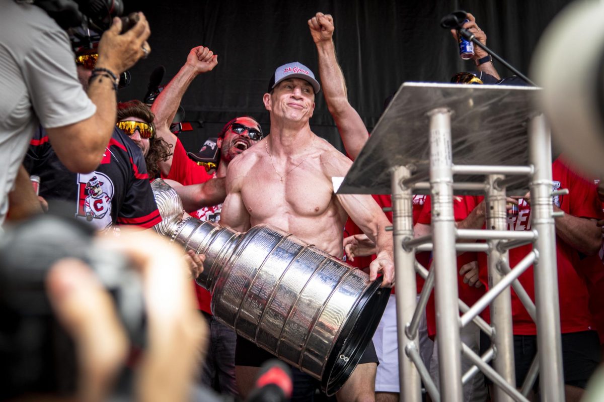 Head coach Rod Brind'Amour makes a face before lifting up the Stanley Cup during the Carolina Hurricanes Championship Celebration in downtown Raleigh on Saturday, June 20, 2026.
