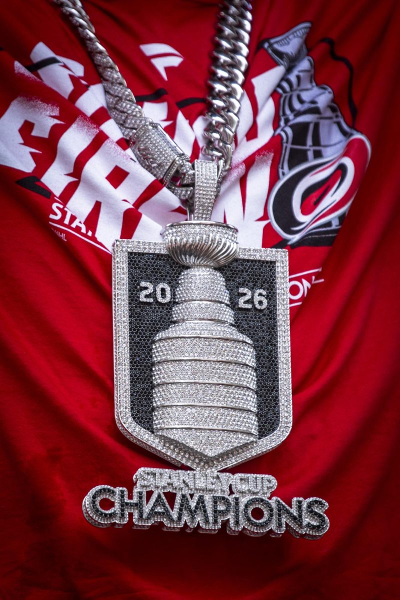 Hurricanes players wore commemorative shirts and chains recognizing their Stanley Cup victory during the Carolina Hurricanes Championship Celebration in downtown Raleigh on Saturday, June 20, 2026.