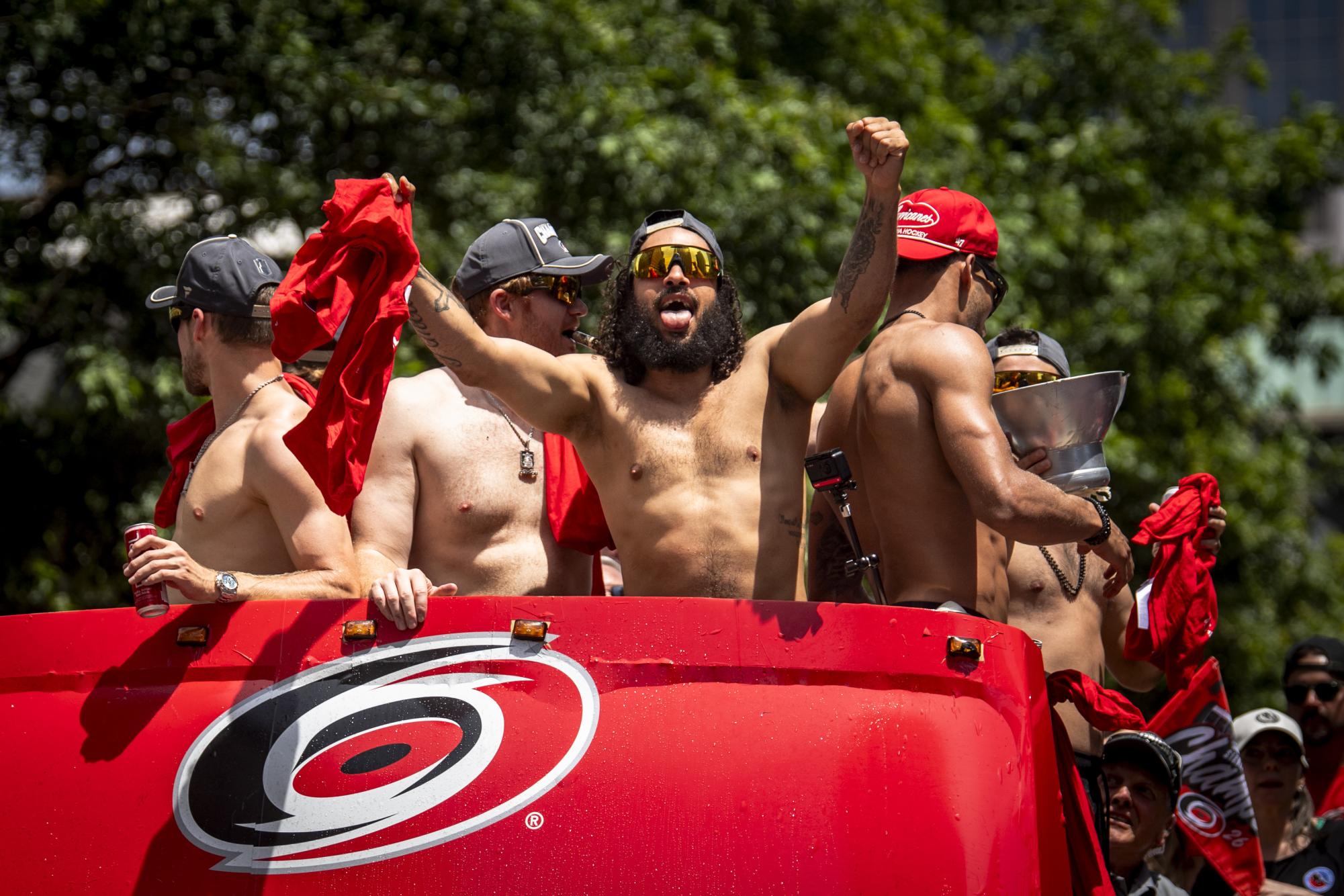 Defenseman Jalen Chatfield sticks out his tongue during the Carolina Hurricanes Championship Celebration in downtown Raleigh on Saturday, June 20, 2026.