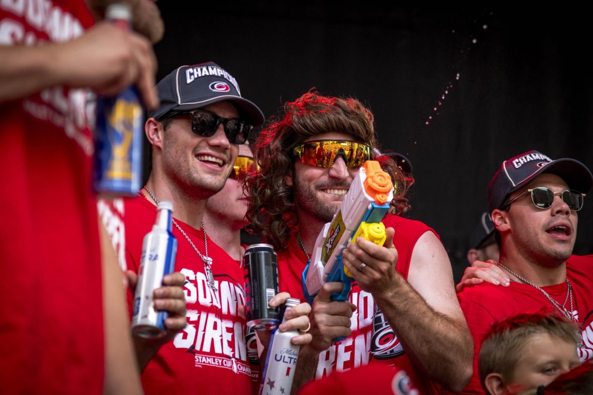 Defenseman Shayne Gostisbehere squirts a water gun during the Carolina Hurricanes Championship Celebration in downtown Raleigh on Saturday, June 20, 2026.