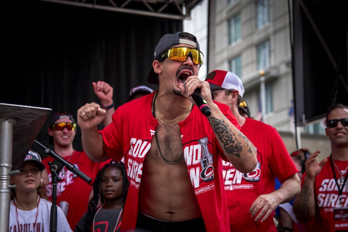 Winger Seth Jarvis yells into the microphone during his remarks to the crowd at the Carolina Hurricanes Championship Celebration in downtown Raleigh on Saturday, June 20, 2026.