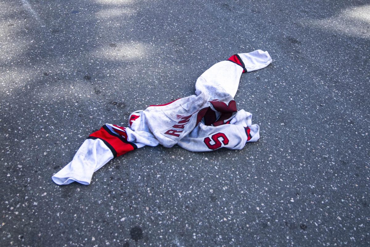 Former Hurricanes winger Mikko Rantanen's jersey lies torn and trodden in the street during the Carolina Hurricanes Championship Celebration in downtown Raleigh on Saturday, June 20, 2026. Rantanen was traded to the Dallas Stars for center Logan Stankoven after a short stint with the Hurricanes.