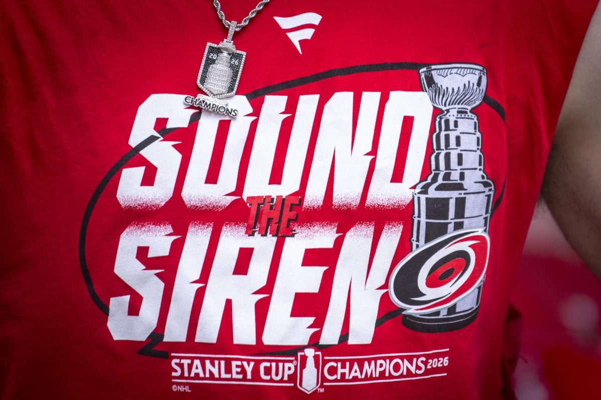 Hurricanes players wore commemorative shirts and chains recognizing their Stanley Cup victory during the Carolina Hurricanes Championship Celebration in downtown Raleigh on Saturday, June 20, 2026.