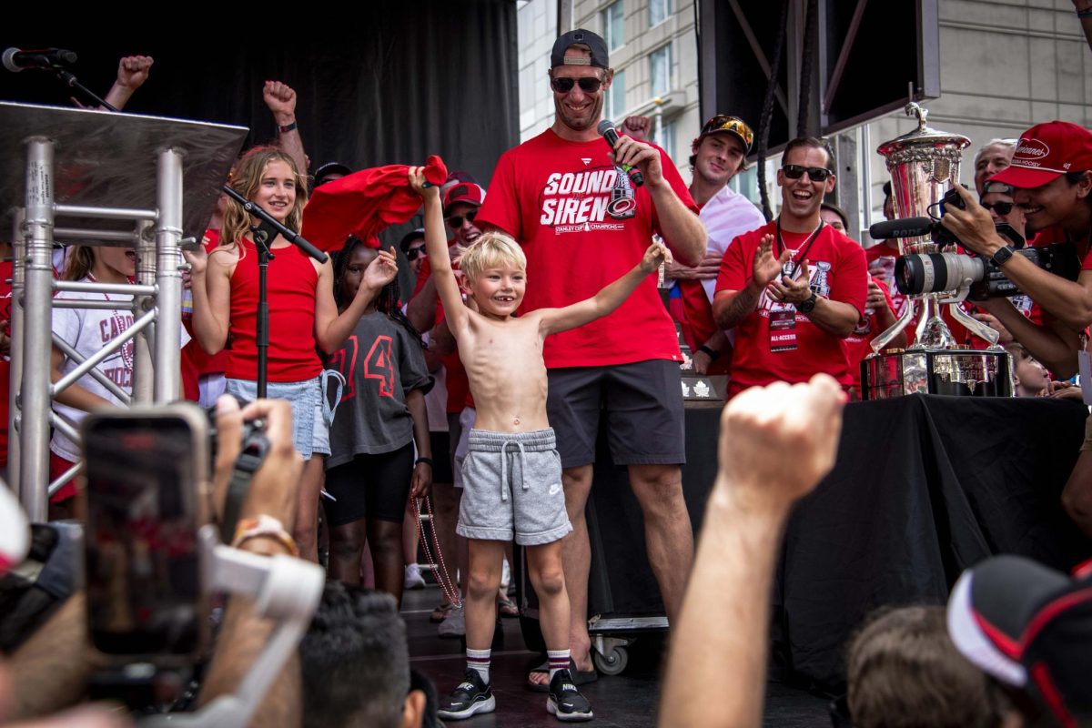 Center Jordan Staal celebrates with his son on stage during the Carolina Hurricanes Championship Celebration in downtown Raleigh on Saturday, June 20, 2026.