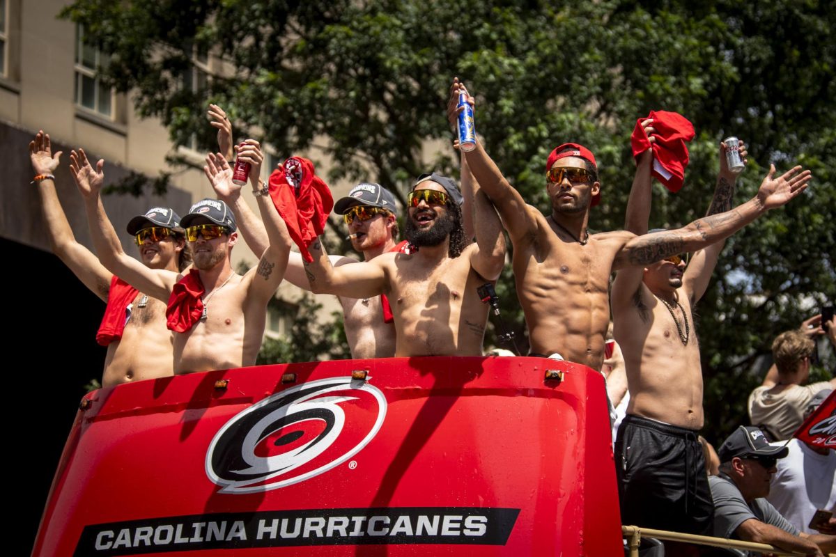 Hurricanes players lead the "Storm Surge" during the Carolina Hurricanes Championship Celebration in downtown Raleigh on Saturday, June 20, 2026.