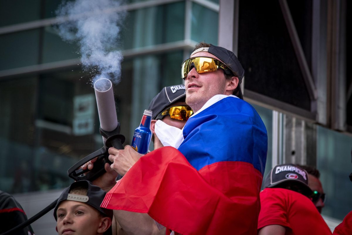 Winger Andrei Svechnikov plays with a smoke gun during the Carolina Hurricanes Championship Celebration in downtown Raleigh on Saturday, June 20, 2026.