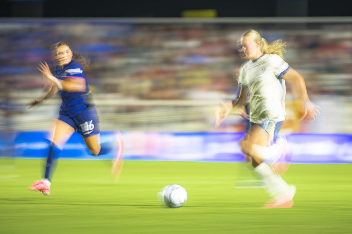 Midfielder Riley Jackson (16) races back to defend Seattle Reign FC forward Maddie Dahlien (5) during the game in First Horizon Stadium at WakeMed Soccer Park on Saturday, July 4, 2026. NC Courage FC defeated Seattle Reign FC 3-1.