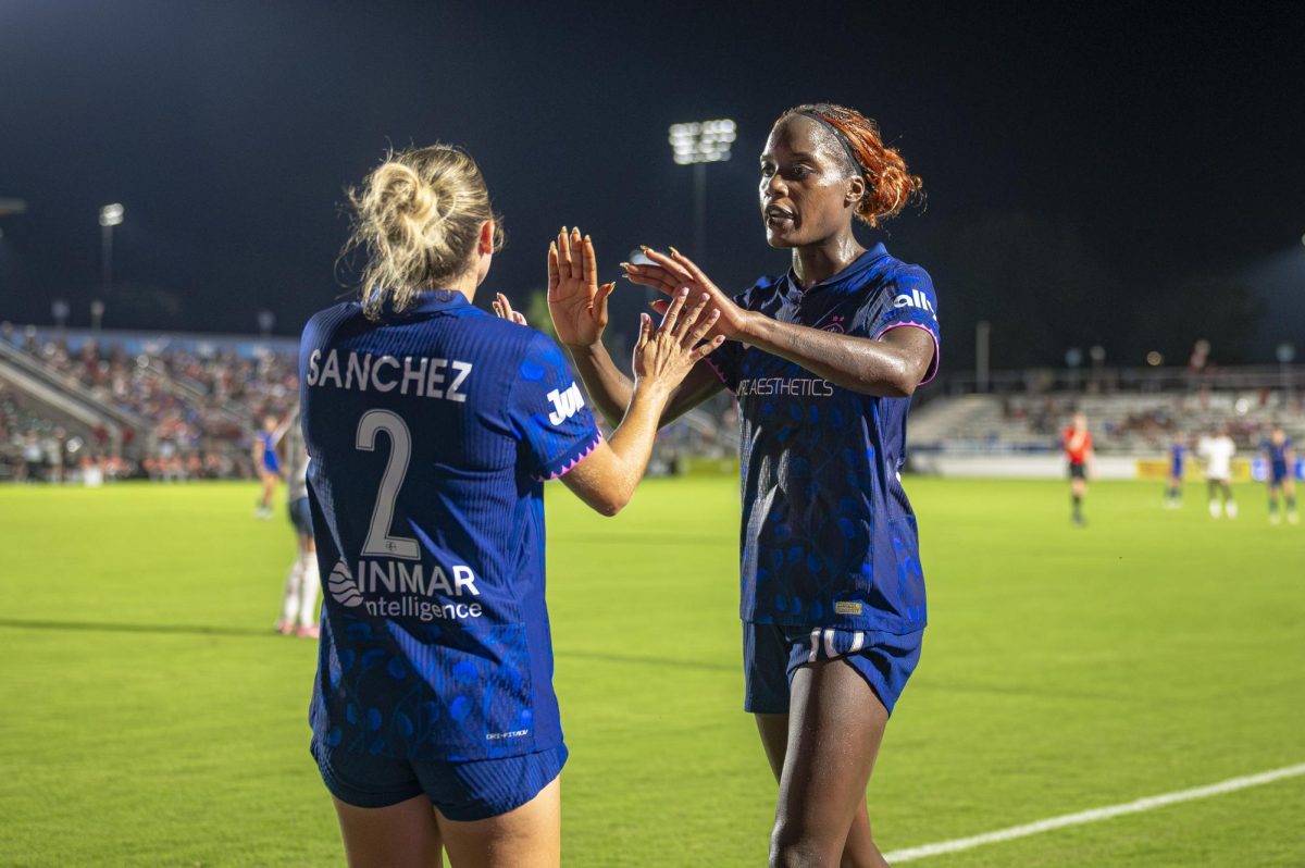 Midfielder Ashley Sanchez (2) high-fives forward Evelyn Ijeh (10) before coming off the pitch during the game against Seattle Reign FC in First Horizon Stadium at WakeMed Soccer Park on Saturday, July 4, 2026. NC Courage FC defeated Seattle Reign FC 3-1.