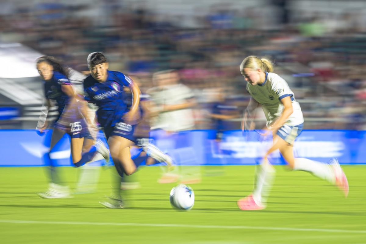 Defenders Uno Shiragaki (18) and Maycee Bell (25) race back to defend during the game against Seattle Reign FC in First Horizon Stadium at WakeMed Soccer Park on Saturday, July 4, 2026. NC Courage FC defeated Seattle Reign FC 3-1.