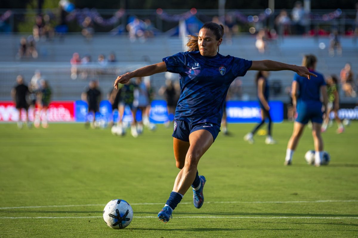 Midfielder Carly Wickenheiser (14) takes a shot in warmups before the game against Seattle Reign FC in First Horizon Stadium at WakeMed Soccer Park on Saturday, July 4, 2026. NC Courage FC defeated Seattle Reign FC 3-1.
