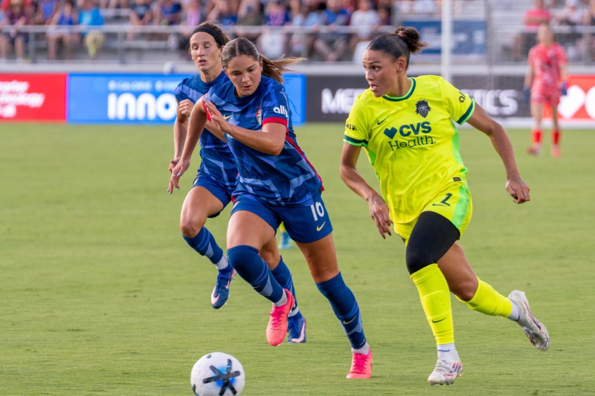 Midfielder Riley Jackson chases after forward Trinity Rodman during the match against Washington Spirit FC at First Horizon Stadium at WakeMed Soccer Park on Saturday, July 11, 2026. The Spirit beat the Courage 2-0.