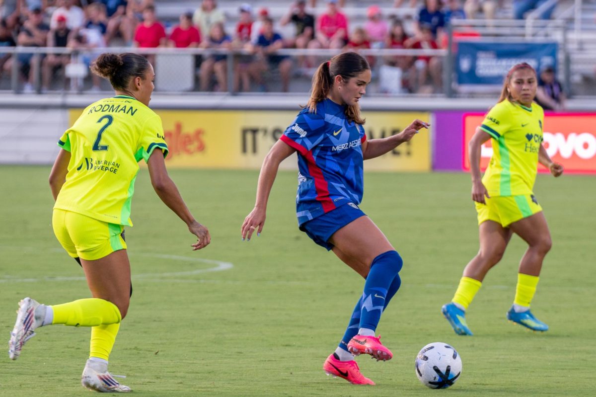 Midfielder Riley Jackson dribbles the ball through the defense during the match against Washington Spirit FC at First Horizon Stadium at WakeMed Soccer Park on Saturday, July 11, 2026. The Spirit beat the Courage 2-0.