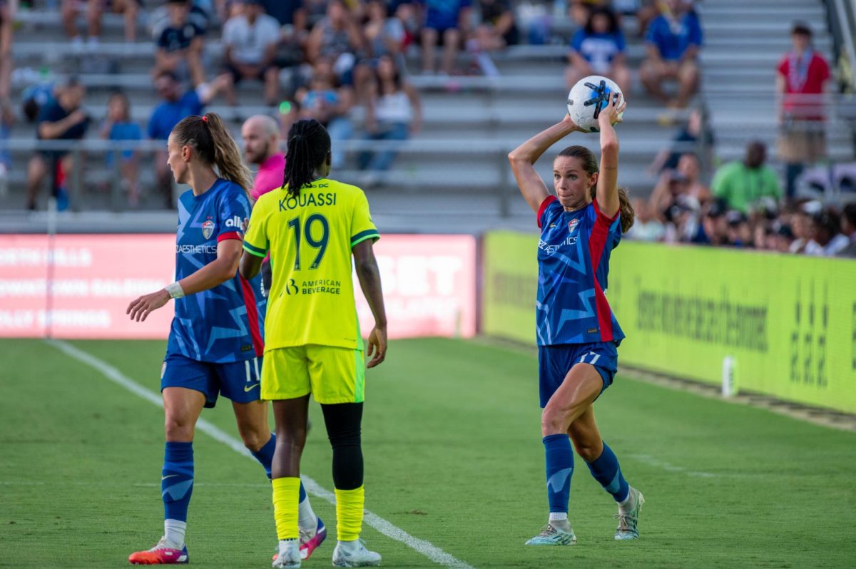 Midfielder Dani Weatherholt throws in the ball during the match against Washington Spirit FC at First Horizon Stadium at WakeMed Soccer Park on Saturday, July 11, 2026. The Spirit beat the Courage 2-0.