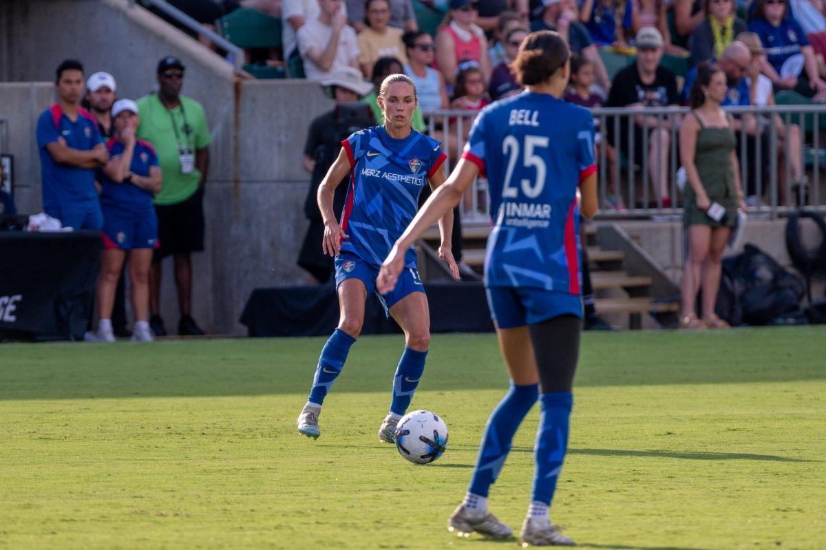 Midfielder Dani Weatherholt passes the ball to defender Maycee Bell during the match against Washington Spirit FC at First Horizon Stadium at WakeMed Soccer Park on Saturday, July 11, 2026. The Spirit beat the Courage 2-0.